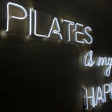 Letrero Led Neon Pilates en Acabado Acrílico Transparente con Luz Cálida